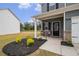 Welcoming front porch with seating area, complementing the charming exterior of the home at 231 Limestone Cir, Conyers, GA 30013