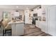 Modern kitchen with stainless steel appliances, white cabinets, and granite countertops at 231 Limestone Cir, Conyers, GA 30013