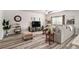 Cozy living room featuring modern decor, plush seating, and ample natural light at 231 Limestone Cir, Conyers, GA 30013