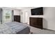 Comfortable main bedroom with dressers, a bed, and windows offering natural light at 231 Limestone Cir, Conyers, GA 30013