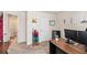 Office space with dual monitors, desk, a colorful storage cart and a mini fridge at 231 Limestone Cir, Conyers, GA 30013