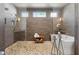 Beautiful bathroom with a freestanding tub, pebble-stone shower floor, and modern fixtures at 260 Jasmine Garden Way, Alpharetta, GA 30009
