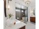 Elegant bathroom with a glass-enclosed shower, freestanding tub, and stylish lighting at 260 Jasmine Garden Way, Alpharetta, GA 30009