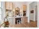 Beautiful dressing room with natural lighting, ample storage, and a vanity with accent mirror at 260 Jasmine Garden Way, Alpharetta, GA 30009