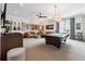 An open game room with a pool table, sofa and ottomans, decorated with guitars and music-themed wall art at 260 Jasmine Garden Way, Alpharetta, GA 30009