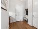 Hallway with bench, coat rack, and hardwood floors at 260 Jasmine Garden Way, Alpharetta, GA 30009