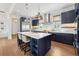 Modern kitchen with an island, stainless steel appliances, ample cabinet space, and stylish countertops at 260 Jasmine Garden Way, Alpharetta, GA 30009