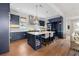 Well-equipped kitchen with a large center island, pendant lighting, and stainless steel appliances at 260 Jasmine Garden Way, Alpharetta, GA 30009
