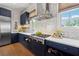 Bright kitchen featuring stainless steel appliances, designer backsplash, and stylish cabinets at 260 Jasmine Garden Way, Alpharetta, GA 30009