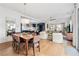 Open-concept living space featuring dining, kitchen, and living areas, perfect for entertaining at 260 Jasmine Garden Way, Alpharetta, GA 30009