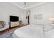 Beautiful main bedroom with white walls, wood floors, and decorative accent pieces at 260 Jasmine Garden Way, Alpharetta, GA 30009