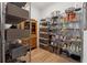 Organized pantry with metal shelving and wooden accents providing ample storage space at 260 Jasmine Garden Way, Alpharetta, GA 30009