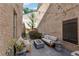Inviting outdoor patio with modern fire pit, lounge seating, and string lights for relaxing evenings at 260 Jasmine Garden Way, Alpharetta, GA 30009