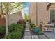 Charming walkway between buildings featuring lush landscaping and stone pavers at 260 Jasmine Garden Way, Alpharetta, GA 30009