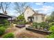 Charming backyard showcasing raised garden beds, lush greenery, and a well-maintained lawn at 511 Sycamore St, Decatur, GA 30030