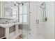 Bright bathroom featuring double sinks, white subway tile shower, and plantation shutters at 511 Sycamore St, Decatur, GA 30030