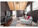 Spacious bonus room featuring stylish decor, vaulted ceiling, hardwood floors, and abundant natural light at 511 Sycamore St, Decatur, GA 30030
