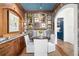 Charming dining room with wood paneling, patterned wallpaper, and seating for four around a round table at 511 Sycamore St, Decatur, GA 30030