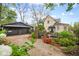 A charming home and detached garage featuring a well-landscaped yard and gravel driveway at 511 Sycamore St, Decatur, GA 30030