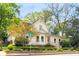Charming two-story home with landscaped yard featuring manicured hedges and lush green trees on a beautiful lot at 511 Sycamore St, Decatur, GA 30030