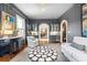 Open-concept living room with neutral colors, wood floors, and arched doorway detail at 511 Sycamore St, Decatur, GA 30030