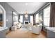 Stylish living room with ample seating, elegant decor, and a large window with natural light at 511 Sycamore St, Decatur, GA 30030