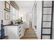 Charming mudroom featuring custom cabinetry, a built-in bench, and stylish decor with a herringbone patterned floor at 511 Sycamore St, Decatur, GA 30030