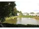 Beautiful lake view showcasing serene water, manicured lawns, and neighborhood homes at 1920 Stancrest Nw Trce, Kennesaw, GA 30152