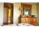 Bedroom with wooden dresser, large mirror and closet space visible in the background at 1920 Stancrest Nw Trce, Kennesaw, GA 30152