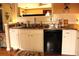 Kitchen with granite countertops, white cabinets, and a black dishwasher at 1920 Stancrest Nw Trce, Kennesaw, GA 30152