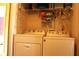 Well-equipped laundry room with washer, dryer, and ample storage space at 1920 Stancrest Nw Trce, Kennesaw, GA 30152