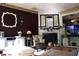 Cozy living room with a fireplace, comfortable seating, and hardwood floors at 1920 Stancrest Nw Trce, Kennesaw, GA 30152