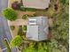 Bird's eye view showcasing the architectural roof design and landscaped gardens around the home at 201 Hunley Ct, Alpharetta, GA 30005