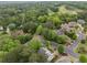 A picturesque community surrounded by lush green trees and golf course at 201 Hunley Ct, Alpharetta, GA 30005