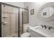 Bathroom featuring glass shower, tile, and stylish mirror at 201 Hunley Ct, Alpharetta, GA 30005
