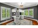 Bedroom with a modern bunkbed that has desk and dresser features plus beautiful hardwood floors and lots of natural light at 201 Hunley Ct, Alpharetta, GA 30005