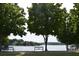 Benches overlooking the scenic lake at 201 Hunley Ct, Alpharetta, GA 30005