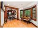 Spacious bar featuring hardwood floors, custom wood trim, and bar seating with beautiful backyard views at 4111 Mcclatchey Ne Cir, Atlanta, GA 30342
