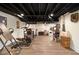 Finished basement features an exposed ceiling, ample lighting, and exercise equipment at 4111 Mcclatchey Ne Cir, Atlanta, GA 30342