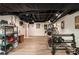 Finished basement features an exposed ceiling, ample lighting, and exercise equipment at 4111 Mcclatchey Ne Cir, Atlanta, GA 30342