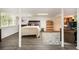 Finished basement featuring neutral decor, a finished ceiling, exposed support beams, and outside view at 4111 Mcclatchey Ne Cir, Atlanta, GA 30342