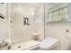 Bright bathroom featuring a large glass shower, toilet and window offering natural light at 4111 Mcclatchey Ne Cir, Atlanta, GA 30342