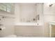 Bathroom featuring a large soaking tub and marble floors at 4111 Mcclatchey Ne Cir, Atlanta, GA 30342