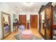 Bedroom featuring hardwood floors, vanity, rug, and an antique armoire at 4111 Mcclatchey Ne Cir, Atlanta, GA 30342