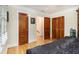 View of the bedroom with hardwood flooring, window with blinds and natural wood doors at 4111 Mcclatchey Ne Cir, Atlanta, GA 30342