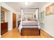 Bedroom with hardwood flooring, canopy bed, and a dresser at 4111 Mcclatchey Ne Cir, Atlanta, GA 30342