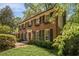 Classic two-story brick home with black shutters and well-maintained landscaping at 4111 Mcclatchey Ne Cir, Atlanta, GA 30342