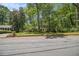 Beautiful brick home with lush greenery, tall trees and manicured front lawn at 4111 Mcclatchey Ne Cir, Atlanta, GA 30342