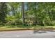 Charming two-story brick home with manicured lawn and mature trees offers a serene setting at 4111 Mcclatchey Ne Cir, Atlanta, GA 30342