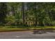 Charming two-story brick home with manicured lawn and mature trees offers a serene setting at 4111 Mcclatchey Ne Cir, Atlanta, GA 30342